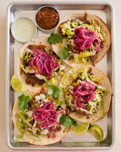 Shawarma Spiced Lentil Tacos with Green Tahini, Roasted Salsa & Sumac Lime Onions