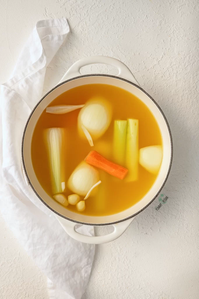 broth and vegetables in a pot