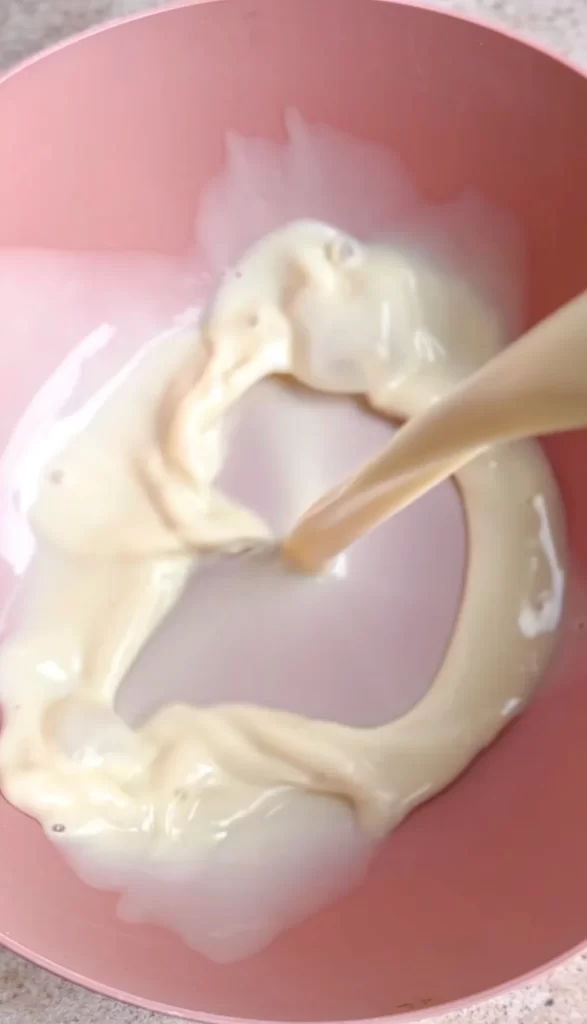 soy milk being added to bowl
