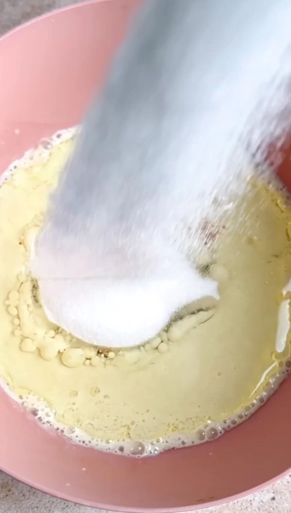 sugar being added to bowl