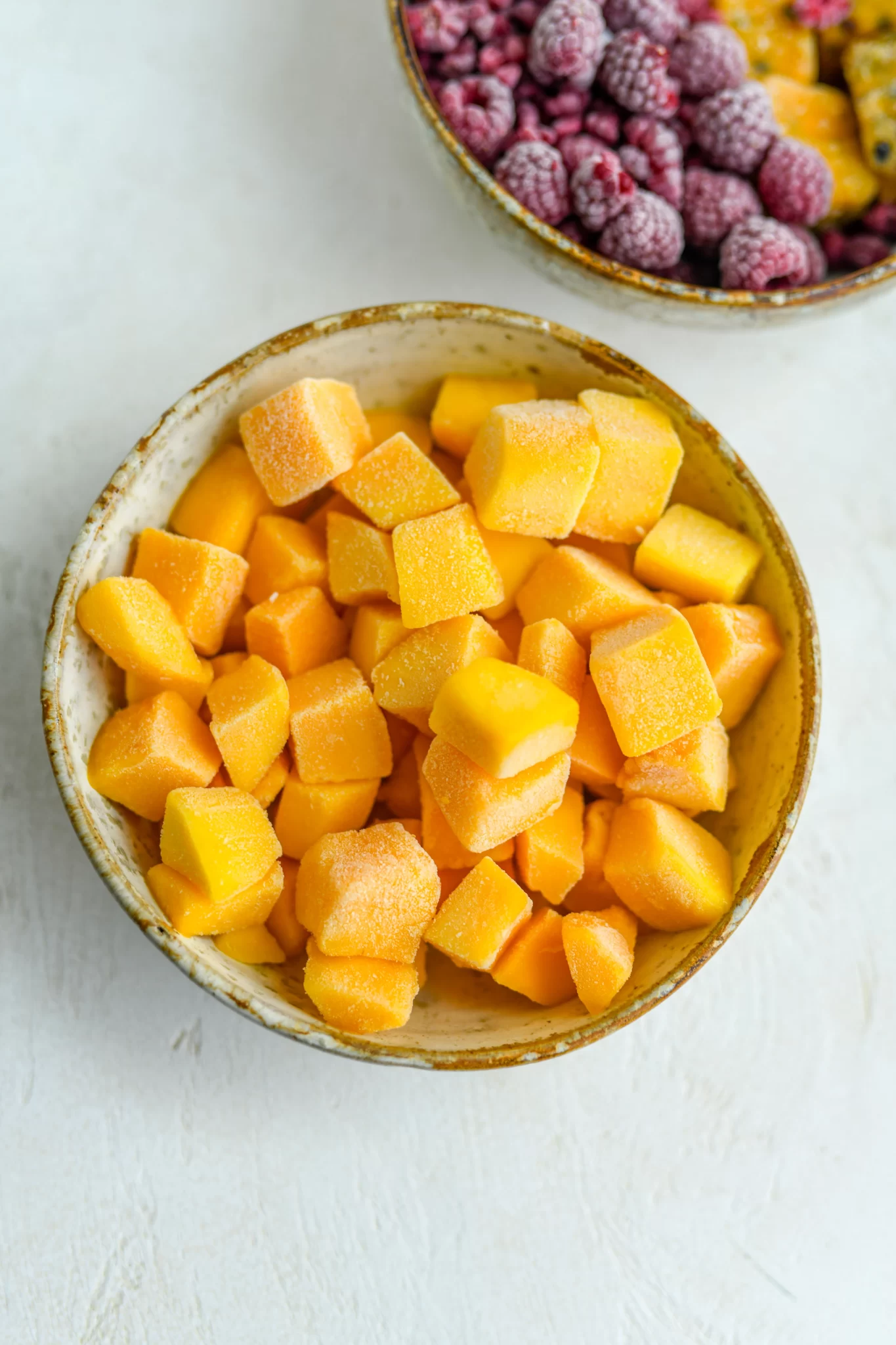 frozen mango chunks in a bowl